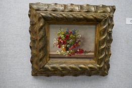 K Vukovic; a pair of small still life oils of flowers, 13 x 10 cms approx