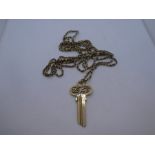 9ct yellow gold pendant in the form of a key, approx 5.5cm marked 375, hung on a yellow metal chain,