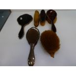 A silver edged dressing table set with tortoise shell back, AF, consisting of a mirror and four brus