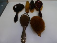 A silver edged dressing table set with tortoise shell back, AF, consisting of a mirror and four brus