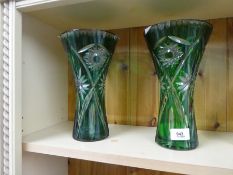 Pair of green heavy cut glass vases