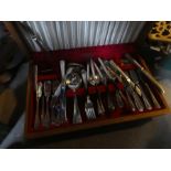 A box of brass items including coffee pots, oil lamps AF and a part cutlery set