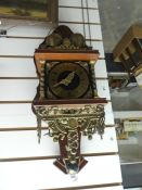 Brass and wood pendulum wall clock