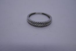 18ct white gold band ring with two rows of diamond chips, marked 750, Size Q, 2.3g