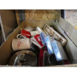 A box of china mugs, glasses, old games and a boxed cutlery set