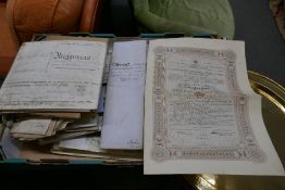 A tray of antique indentures, deeds and other ephemera