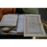 A tray of antique indentures, deeds and other ephemera