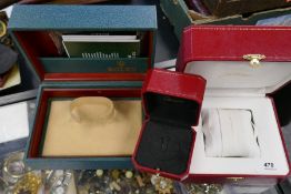 Two wristwatches boxes and one smaller example, bearing markings for Rolex and Cartier