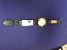 A vintage gent's Revel wristwatch, winds and ticks