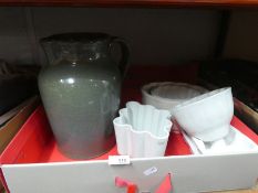 A box containing various china jelly moulds and a large Studio pottery glazed jug