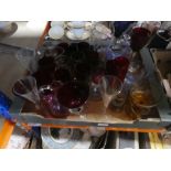 A box of coloured glassware, 4 decanters and a box of glassware