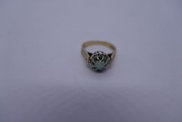 9ct yellow gold cluster ring with central opal surrounded diamond chips, Size K, 3.1g, marked 375