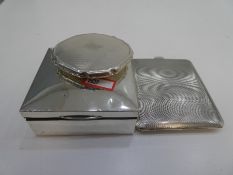 A silver compact of engine turned design along with a silver engine turned cigarette case with gilt