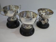 Three silver trophy cups AF, with engraving and hallmarks Birmingham 1918, and London 1935