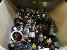 A box full of miniature spirits, including Scotch, etc