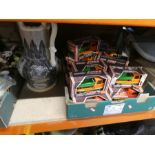 Boxes of various items to include large black hat, toy cars, treen and ornaments