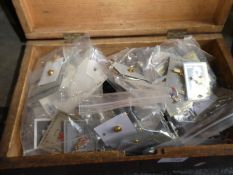Wooden box of pin badges and costume jewellery