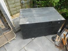 A large wooden bound iron band trunk