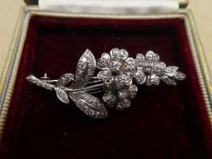 White metal, possibly 18ct white gold, floral design brooch inset with many diamonds, approx 5.5cm