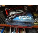 Selection of James Bond models including 1/18 DB5 and additional 007 base stations