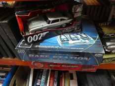 Selection of James Bond models including 1/18 DB5 and additional 007 base stations