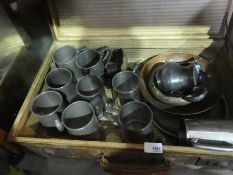 A vintage case of tankards, brass dish teapot, etc