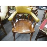 An Early 20th Century mahogany desk chair having a moulded seat and leather back