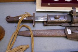 A German bayonet marked Gebr. Heller and a pattern 1907 sword bayonet the blade marked Sanderson, bo