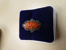 9ct yellow gold dress ring set with orange hardstone surrounded by marcasite