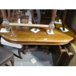 French walnut oval extending table with two leaves and 6 bar back mahogany dining chairs with red an