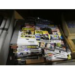 A box of N photo magazines, AA ephemera, camera case, Philips lightbulbs, movie lite, lighting unit,