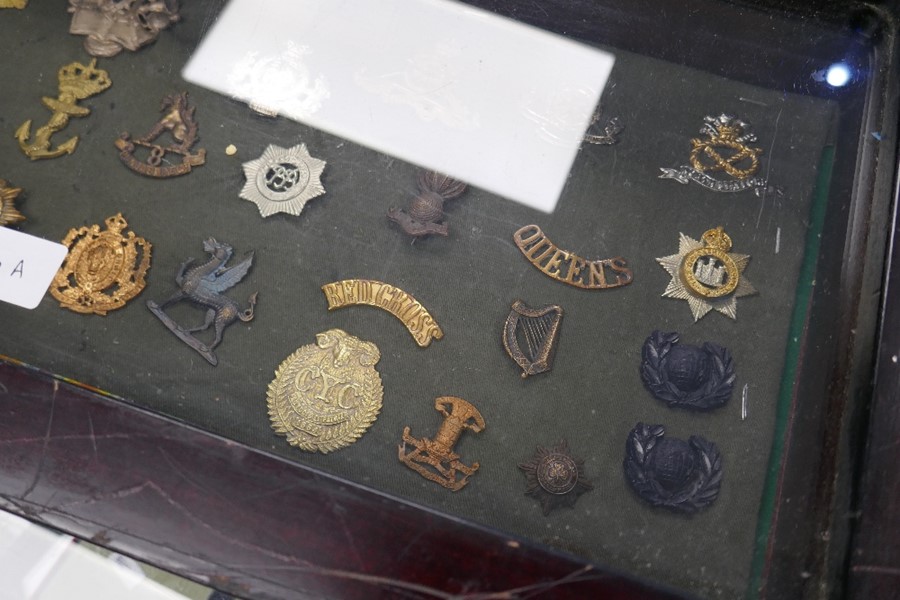 A small glazed display case containing military badges and similar. - Image 2 of 3