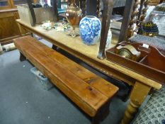 Large stripped pine kitchen table, 244cm wide and a pair of pine benches