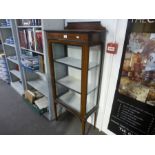 An Edwardian mahogany pillar display cabinet