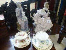 Two Lladro figures of ladies, numbered 978 and 5126 with boxes, and two Royal Albert cups and saucer