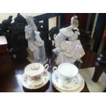 Two Lladro figures of ladies, numbered 978 and 5126 with boxes, and two Royal Albert cups and saucer