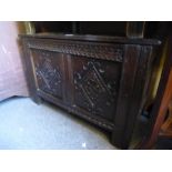 A Small carved oak coffer and an Edwardian 2 tier occasional