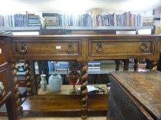 Reproduction oak side table having 2 drawers with shelf below and barley twist legs 156cm wide