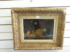 A still life oil painting on wooden panel unsigned in a gilt frame, 36.5x26cm