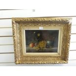 A still life oil painting on wooden panel unsigned in a gilt frame, 36.5x26cm