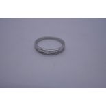 18ct white gold ring set inset with a row of baguette cut diamonds, size N, marked 750, 2.2g