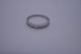 18ct white gold ring set inset with a row of baguette cut diamonds, size N, marked 750, 2.2g