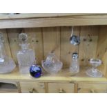 Glass decanters, paperweights, vases, mantle clock, decorative brass bound box, statue of a female t