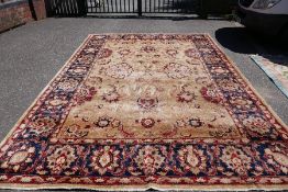 An early 20th century large carpet, blue bordered with floral design 423 x298cm