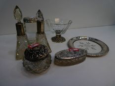 A mixed lot comprising a decorative silver topped trinket dish and two other silver topped glass