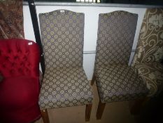 Pair of upholstered dining chairs with blue floral material