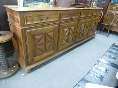 A French style oak side board having 4 drawers with cupboards below 250cm