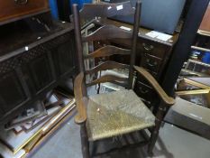 Large wooden carver chair with woven seat