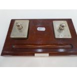 An interesting silver paperweight and silver desk blotter, on a wooden base, hallmarked Birmingham 1