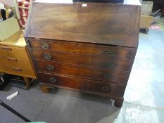 A large writing bureau with 4 drawers and 7 small drawers and cupboard inside